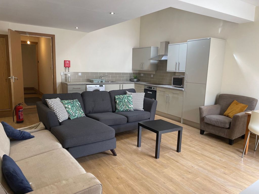 Property photo 1 of 4 Bright And Spacious Living Room Featuring Modern F...