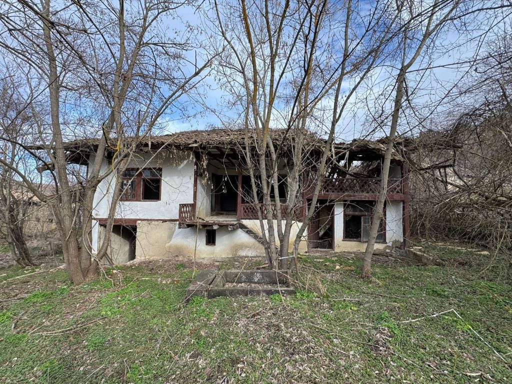 Property photo 1 of 11 Exterior View Of An Old House In Balkanski Village Showing White Walls, Wooden Balcony, And Surrounding Bare Trees.