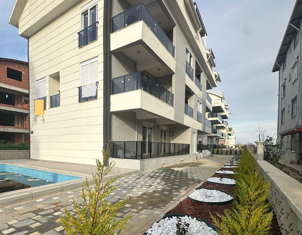 Property photo 1 of 10 Modern Apartment For Investment In Belek, Antalya For Sale - Main View Of The Complex And Pool
