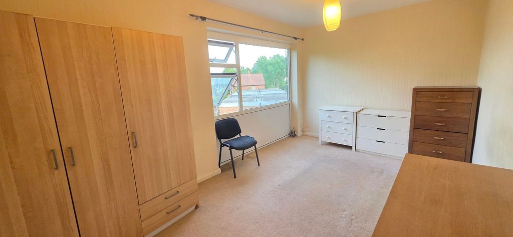 Property photo 3 of 11 Bright Bedroom With Ample Storage And Large Window...