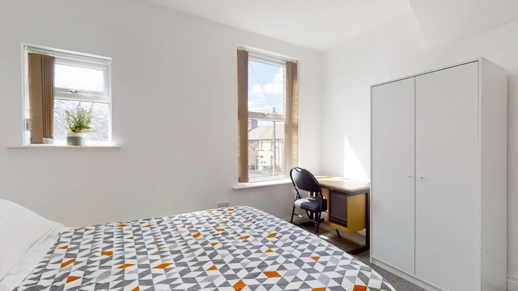 Property photo 1 of 9 Bright And Tidy Double Bedroom Featuring Two Windo...