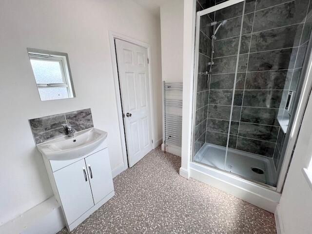 Property photo 2 of 11 Bright And Modern Bathroom Suite Featuring A Spaci...