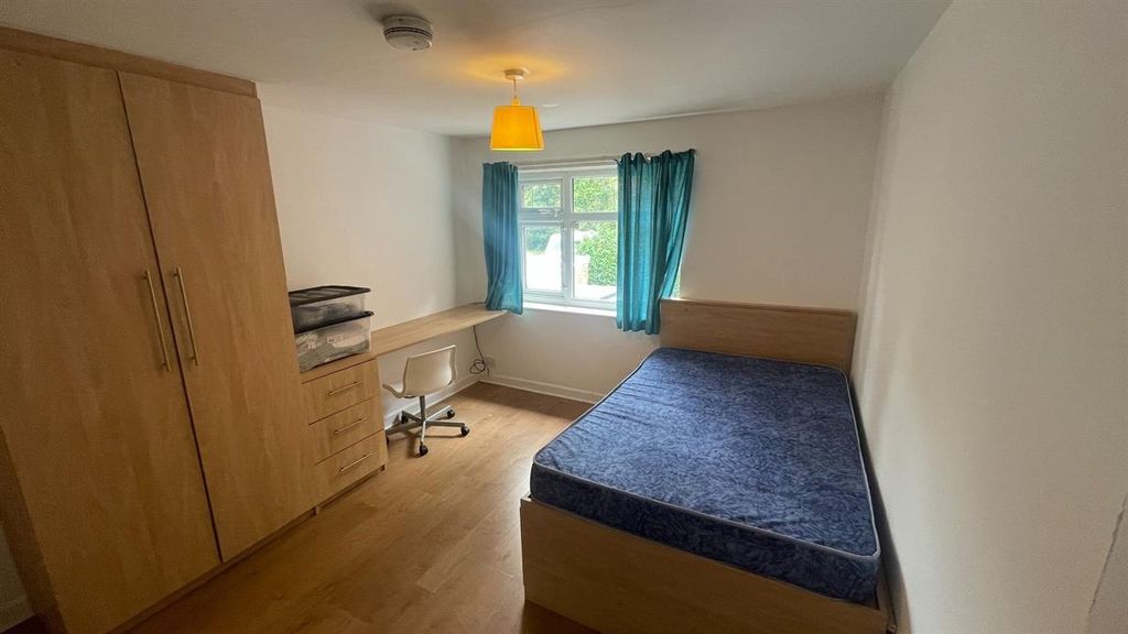 Property photo 2 of 13 A Cozy Single Bedroom Featuring A Spacious Bed, A ...