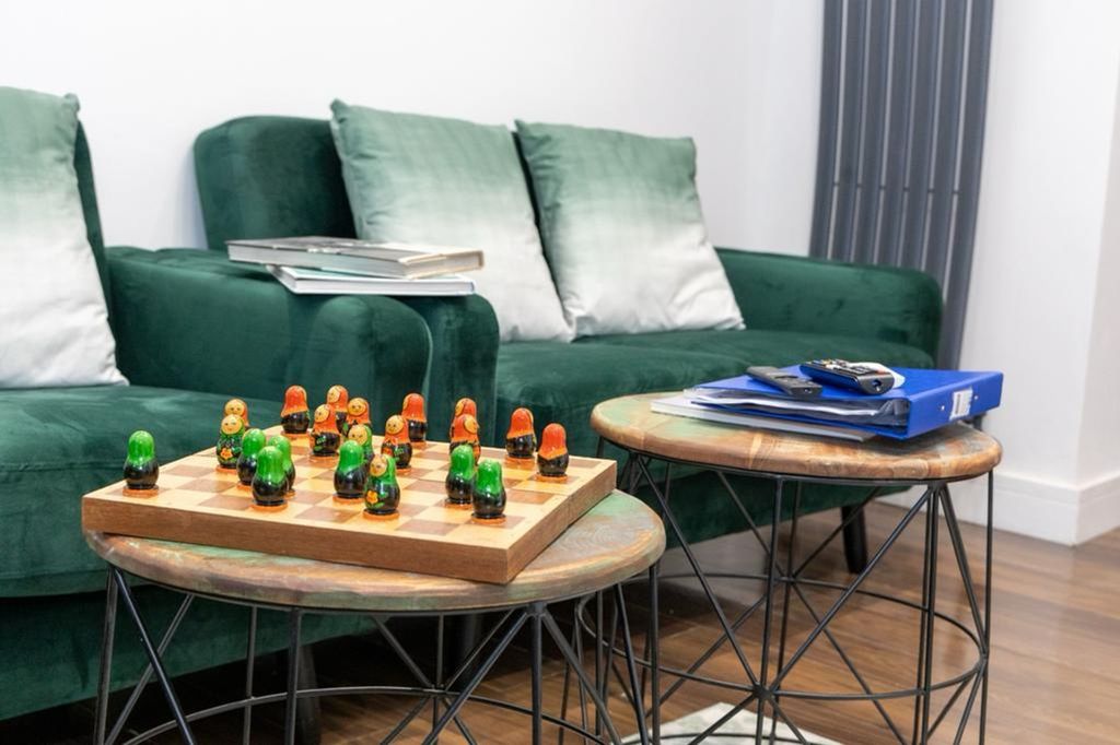 Property photo 2 of 24 A Stylish And Inviting Living Room Featuring Comfo...