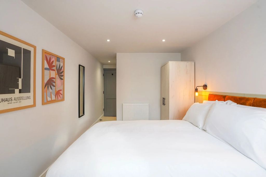 Property photo 1 of 14 A Spacious And Bright Master Bedroom Featuring A l...