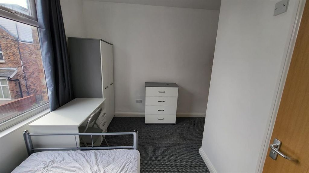 Property photo 3 of 14 A Tidy Single Bedroom Featuring A Large Window Wit...
