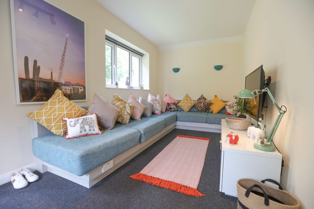 Property photo 3 of 5 Bright And Welcoming Living Room With A Long, Cush...