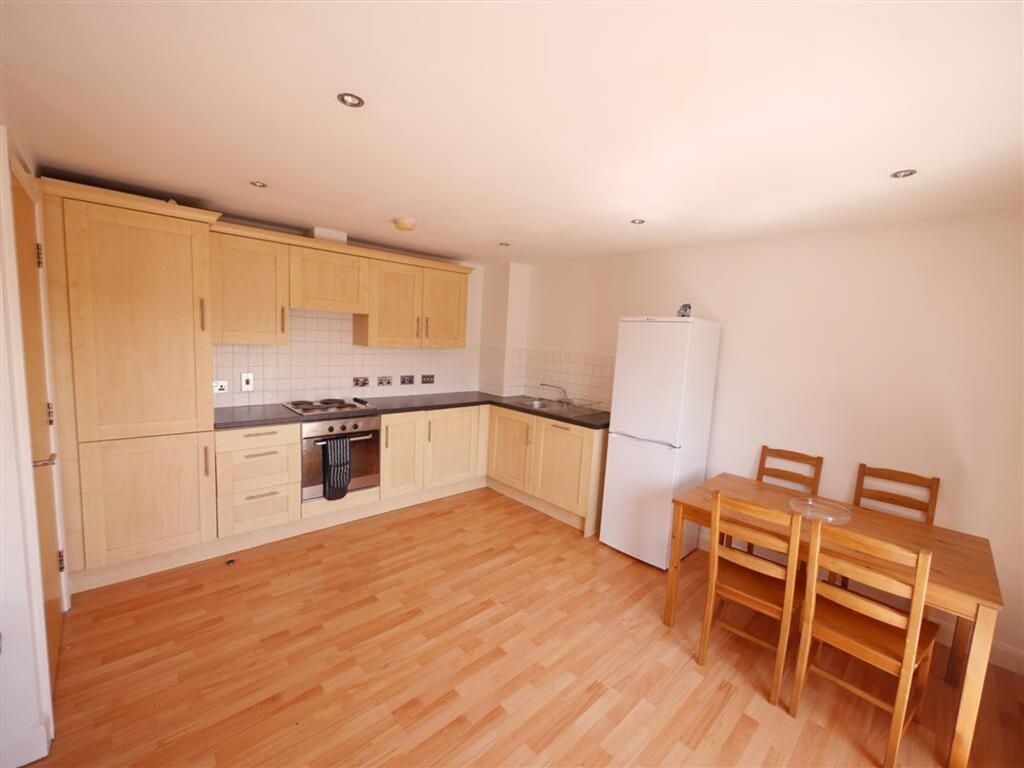 Property photo 2 of 6 Bright And Clean Kitchen With Wooden Cabinetry, Mo...
