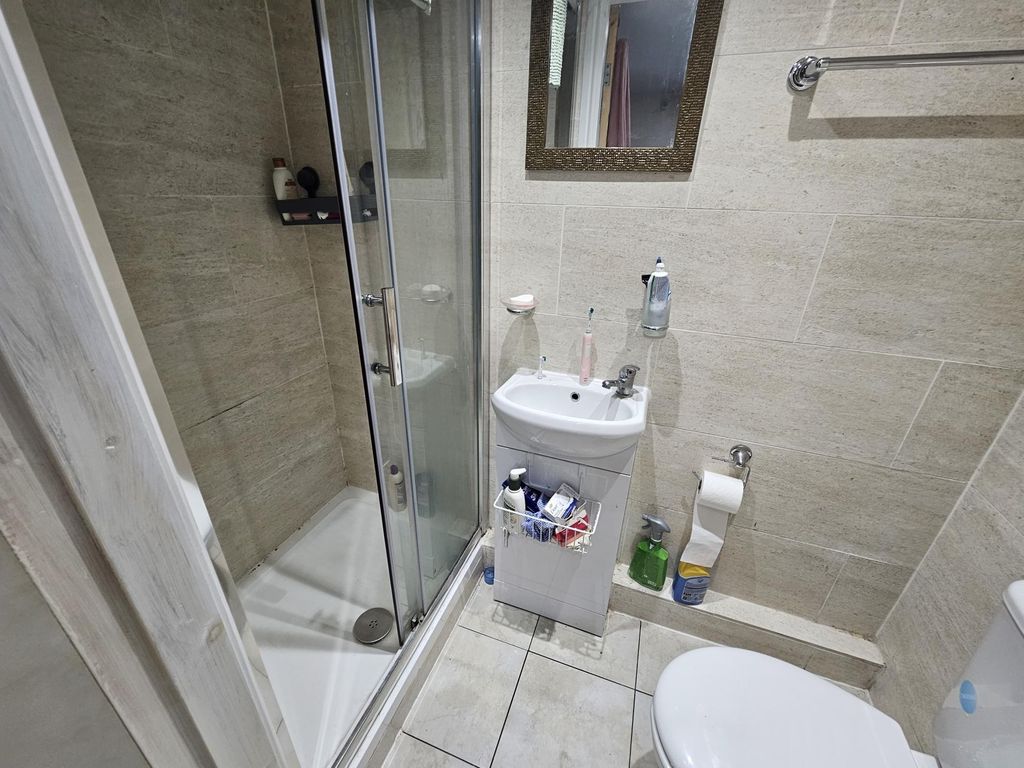 Property photo 3 of 25 A Modern, Clean Bathroom Featuring A Glass-Enclose...