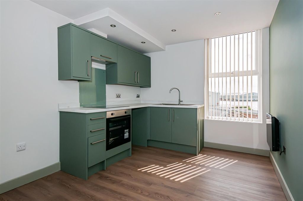 Property photo 1 of 7 Stylish Sage Green Kitchen With Modern Appliances...