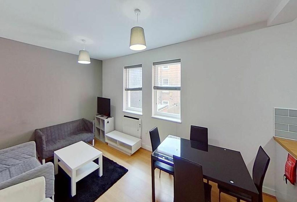 Property photo 1 of 4 Bright And Inviting Living Room Featuring Modern d...