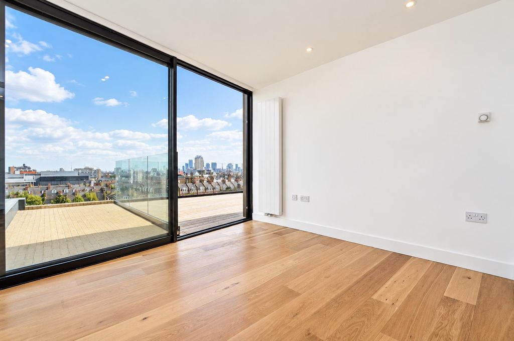 Property photo 3 of 10 Modern Interior With Rooftop Skyline View.Png