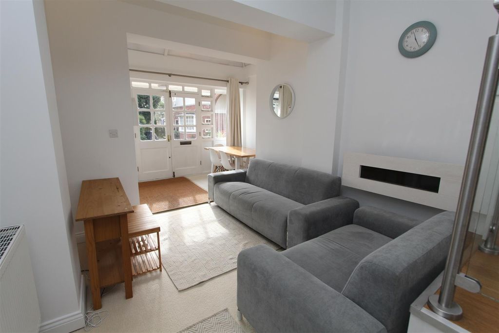 Property photo 1 of 12 Bright Lounge With Plush Grey Sofas And Storage...