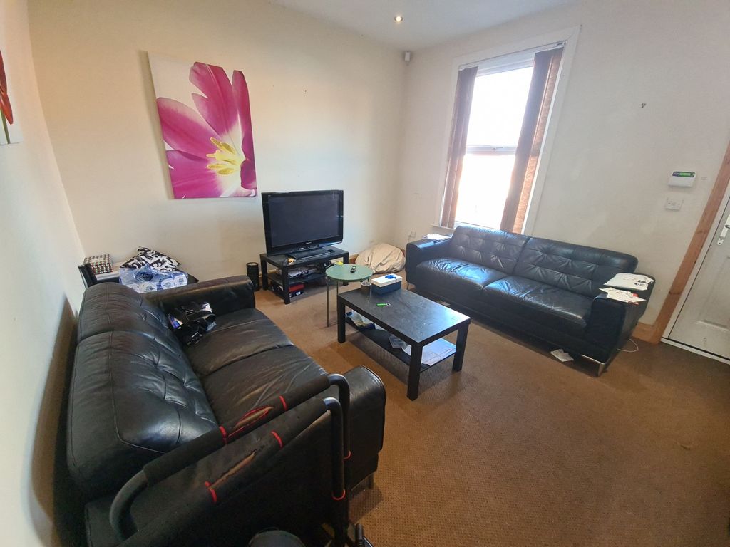 Property photo 2 of 14 A Welcoming, Well-Lit Living Room Featuring A Cont...