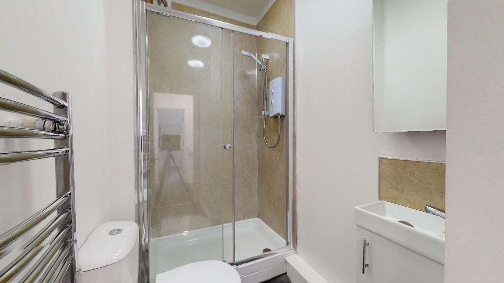 Property photo 2 of 5 Modern Bathroom Suite Featuring A Glass-Enclosed S...