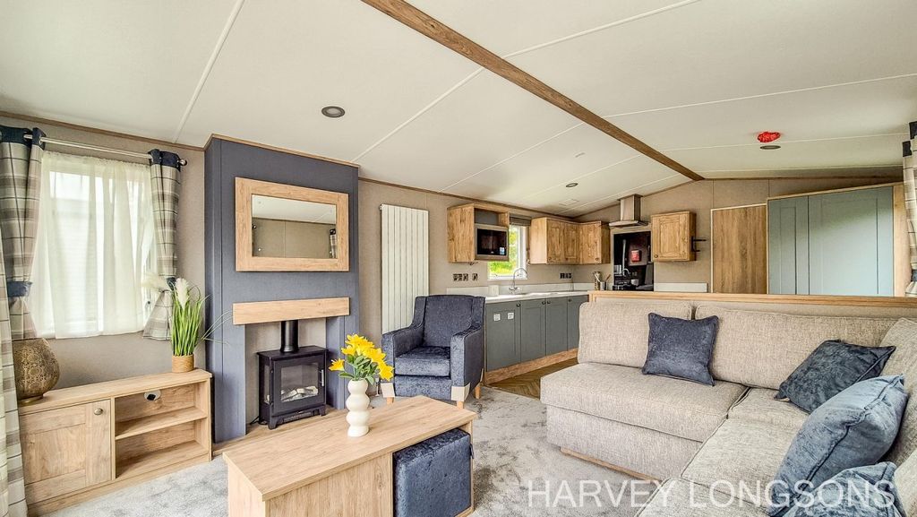 Property photo 1 of 17 Abi Wimbledon Open Plan Lounge And Kitchen With Feature Fireplace And Modern Decor