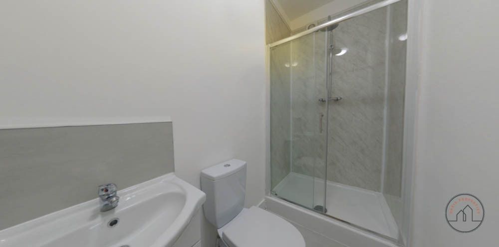 Property photo 2 of 8 Bright, Modern Bathroom With A Walk-In Glass Showe...