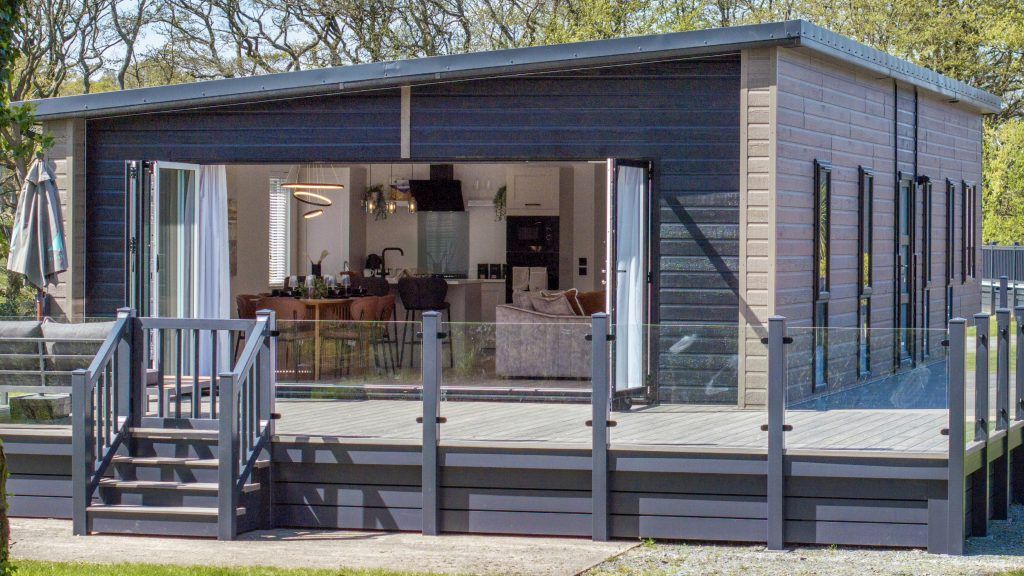 Property photo 1 of 23 Exterior Of The Aspire Luna Lodge At Brynteg With Spacious Decking, Glass Balustrade And Modern Lodge Design.