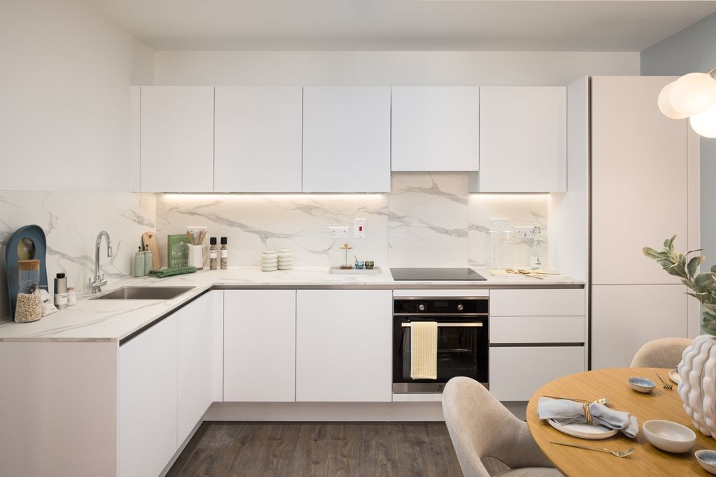 Property photo 3 of 6 Menier Apartments - White Kitchen