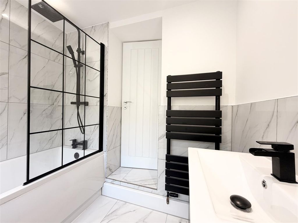 Property photo 3 of 26 Modern Bathroom With Chic Marble-Effect Tiling....