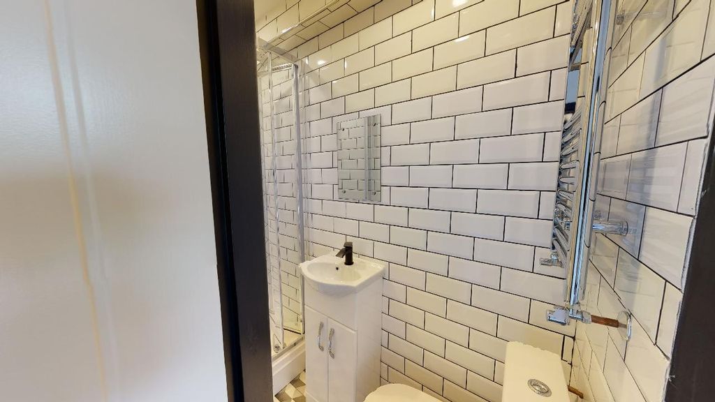 Property photo 1 of 7 A Modern, Clean Bathroom With White Subway Tiles, ...