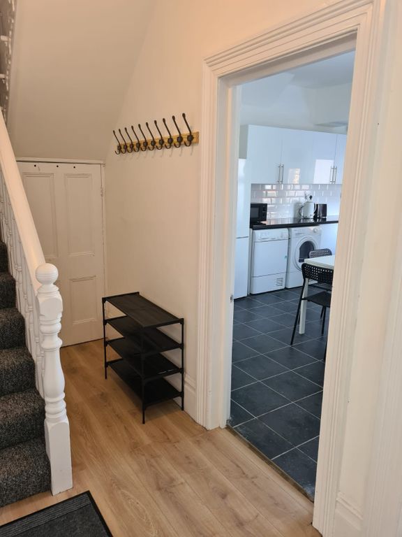 Property photo 1 of 9 Bright And Tidy Hallway Featuring Light Wooden Flo...