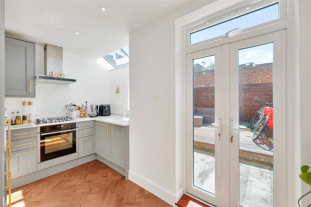 Property photo 3 of 12 Kitchen/Outdoors