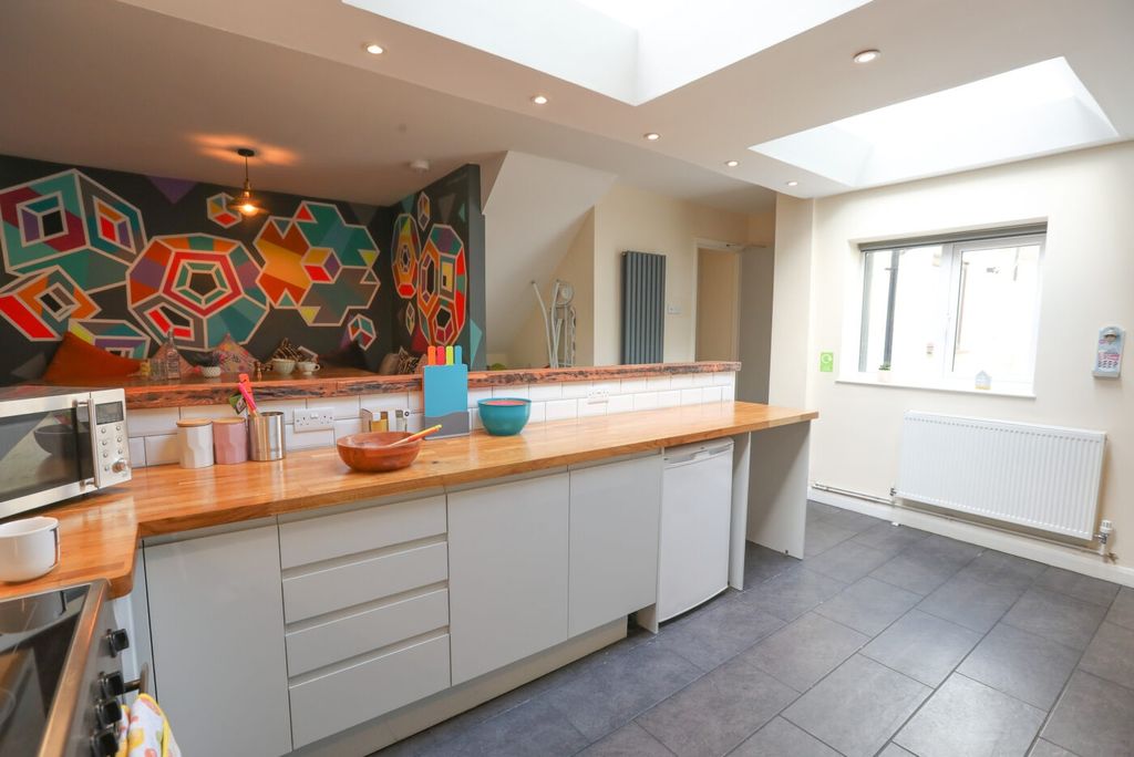 Property photo 2 of 5 Bright And Modern Kitchen Featuring A Spacious Woo...