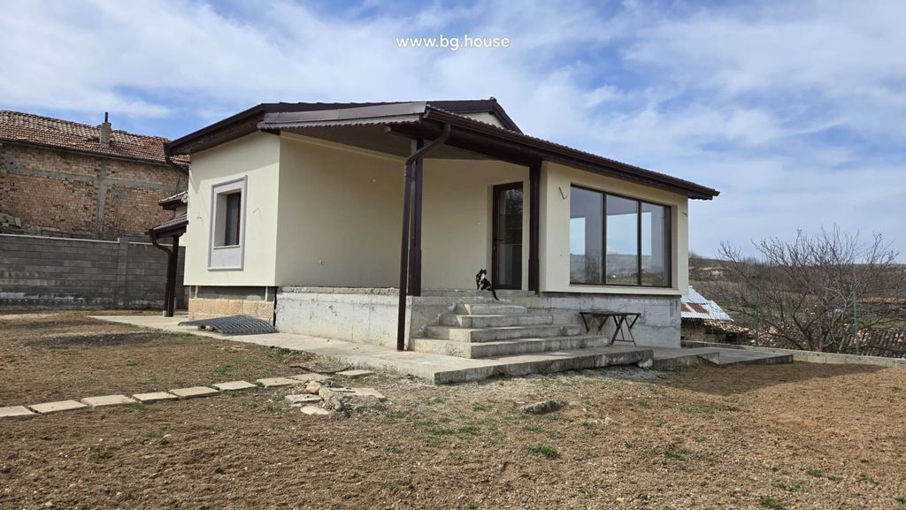 Property photo 1 of 100 View Of The Beige House With A Covered Porch, Concrete Steps, And A Cat Sitting On The Steps