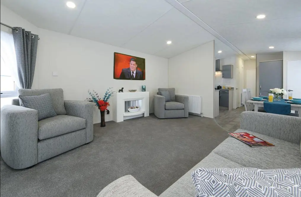 Property photo 2 of 7 Bright Open Plan Lounge With Modern Grey Seating And Dining Area