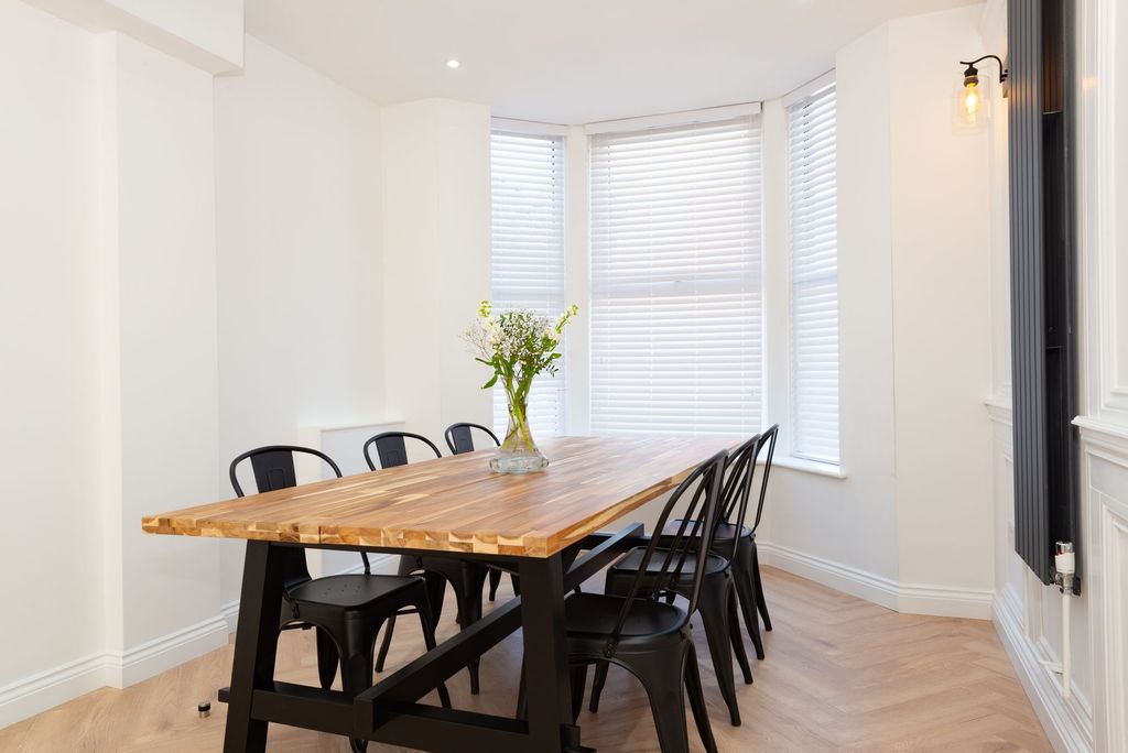 Property photo 3 of 32 Bright, Modern Dining/Living Area With A Solid Woo...