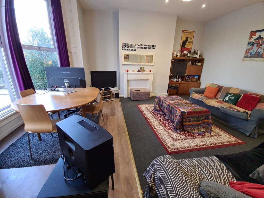 Property photo 3 of 9 A Spacious And Inviting Living Room Featuring Comf...