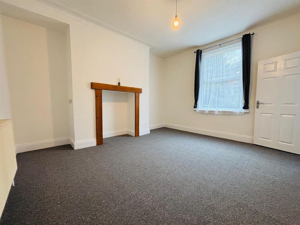 Property photo 2 of 12 Living Room: