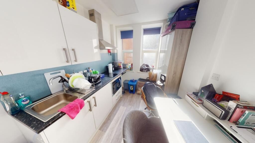 Property photo 3 of 4 A Modern Kitchen Featuring Ample Counter Space, Na...