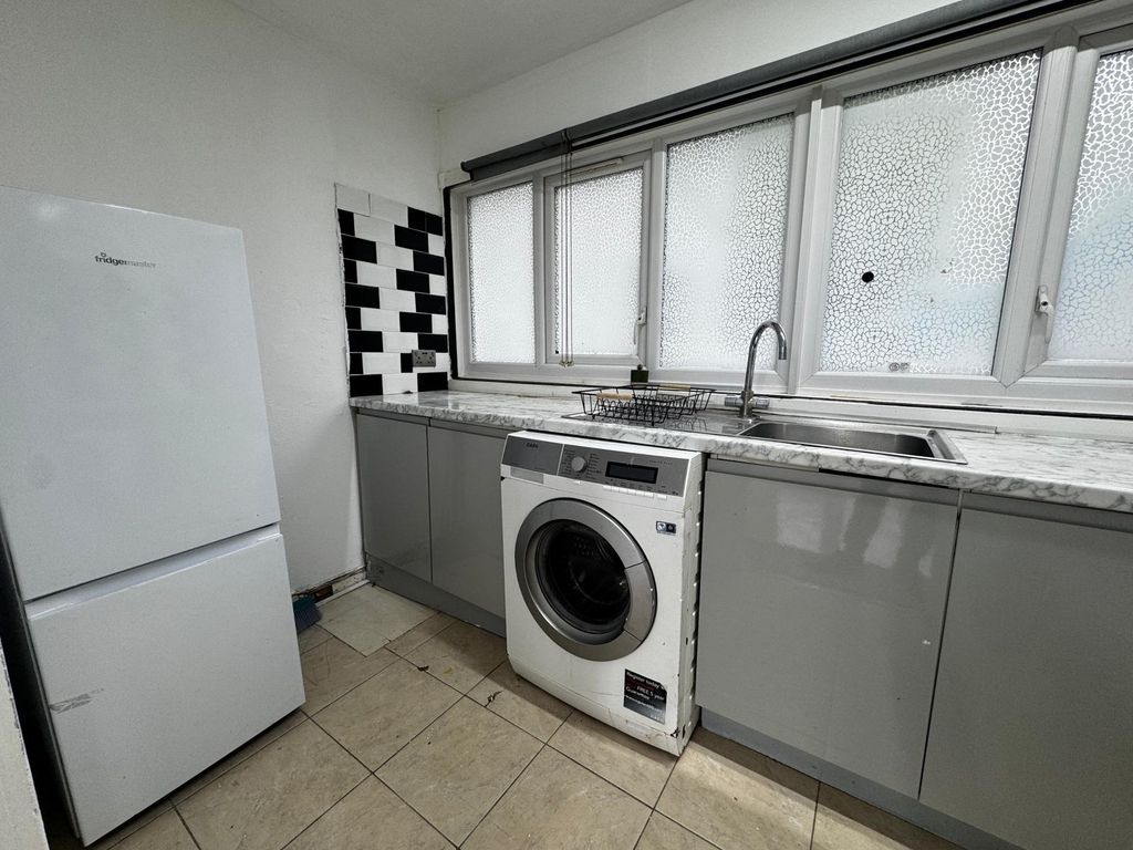 Property photo 3 of 16 Bright Kitchen With Modern Cabinets And Laundry...