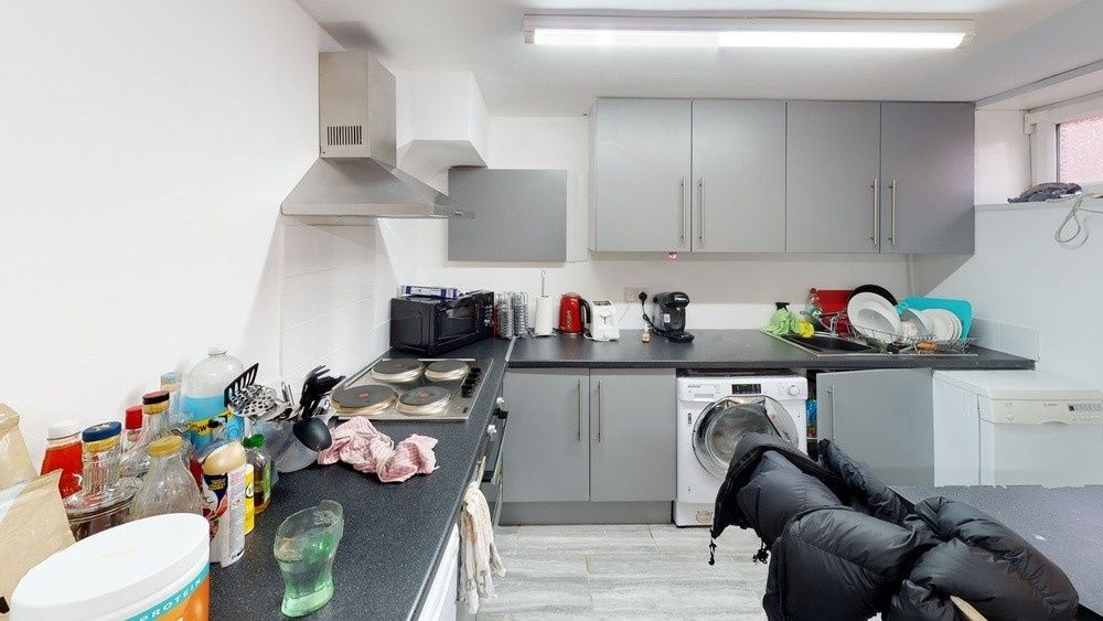 Property photo 2 of 11 Modern And Well-Lit Kitchen Area With Ample Worksp...