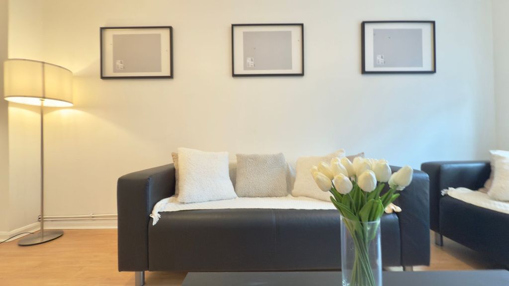 Property photo 3 of 9 Bright, Modern Living Room With A Black Leather So...