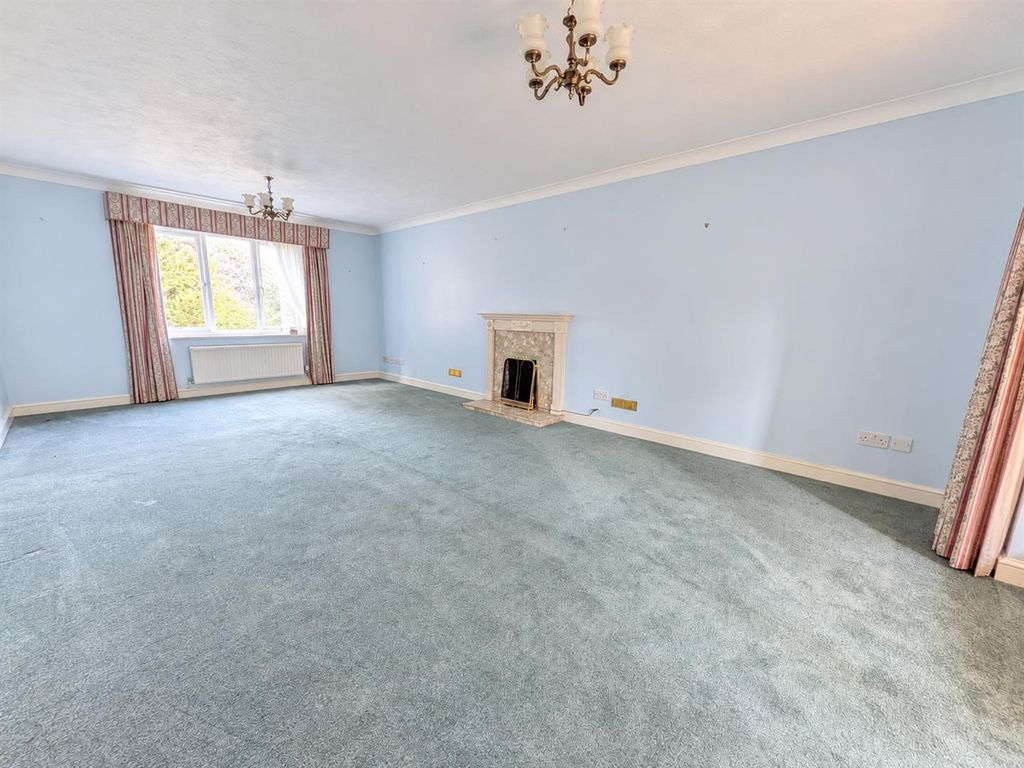 Property photo 3 of 24 Bright Empty Lounge With Classic Fireplace.Png