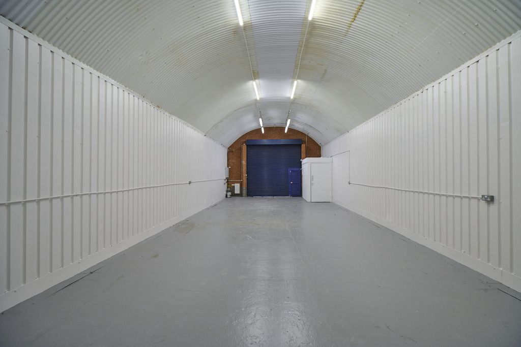 Property photo 1 of 5 An Empty Arch With White Lining And A WC Cubicle To The Back.