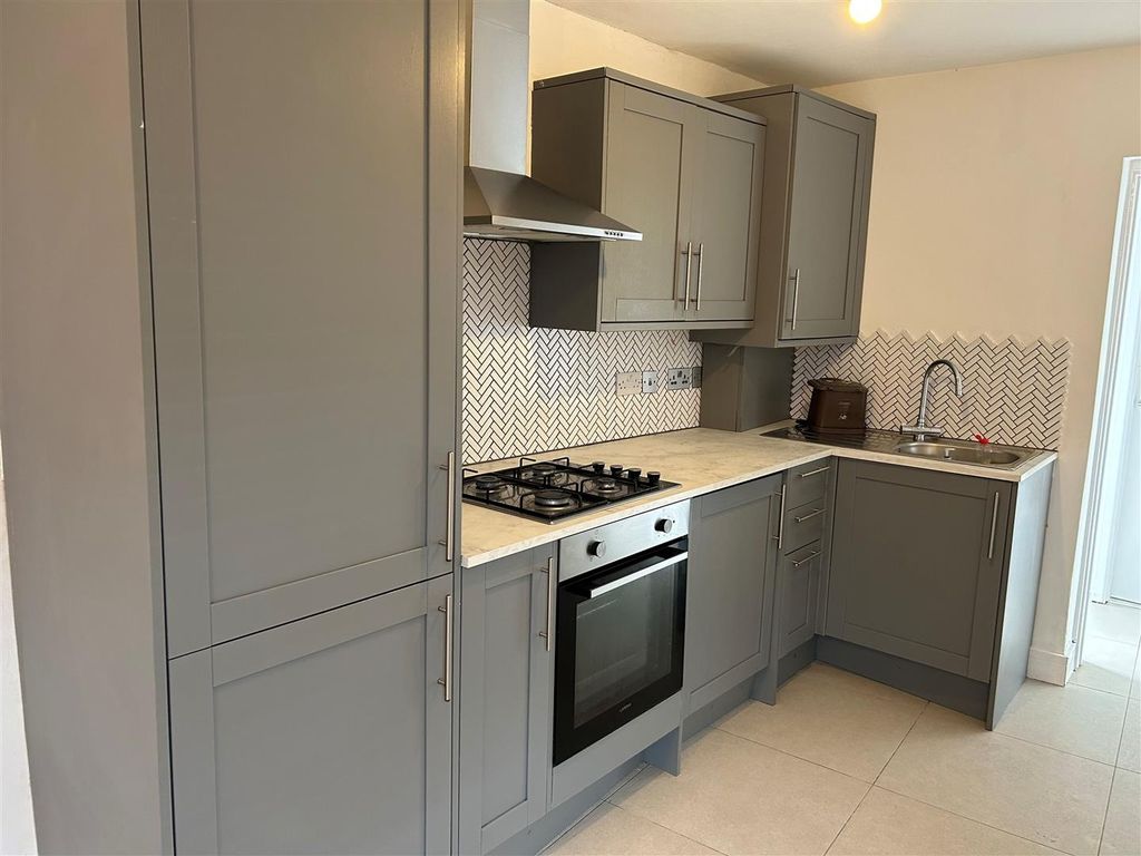 Property photo 1 of 8 Modern Grey Kitchen With Sleek Integrated Oven...