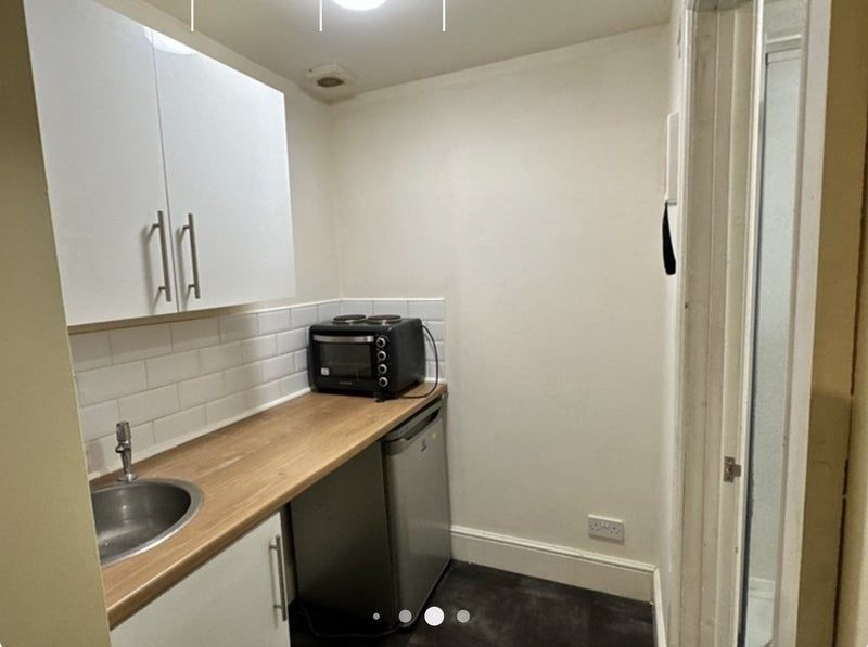 Property photo 3 of 4 Compact Kitchen With Modern White Cabinetry, Woode...