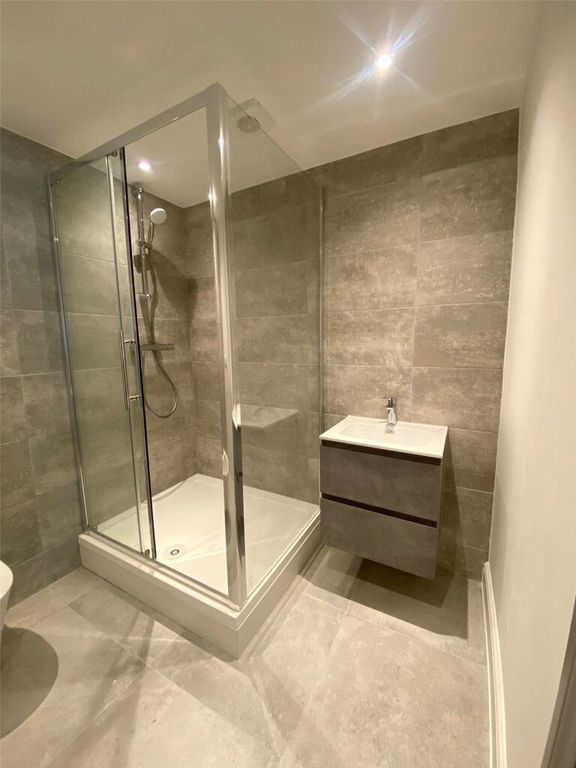 Property photo 3 of 10 Modern And Clean Bathroom Featuring A Spacious Sho...