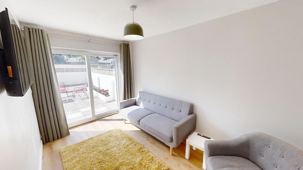 Property photo 2 of 14 Bright And Modern Living Room Featuring A Comforta...