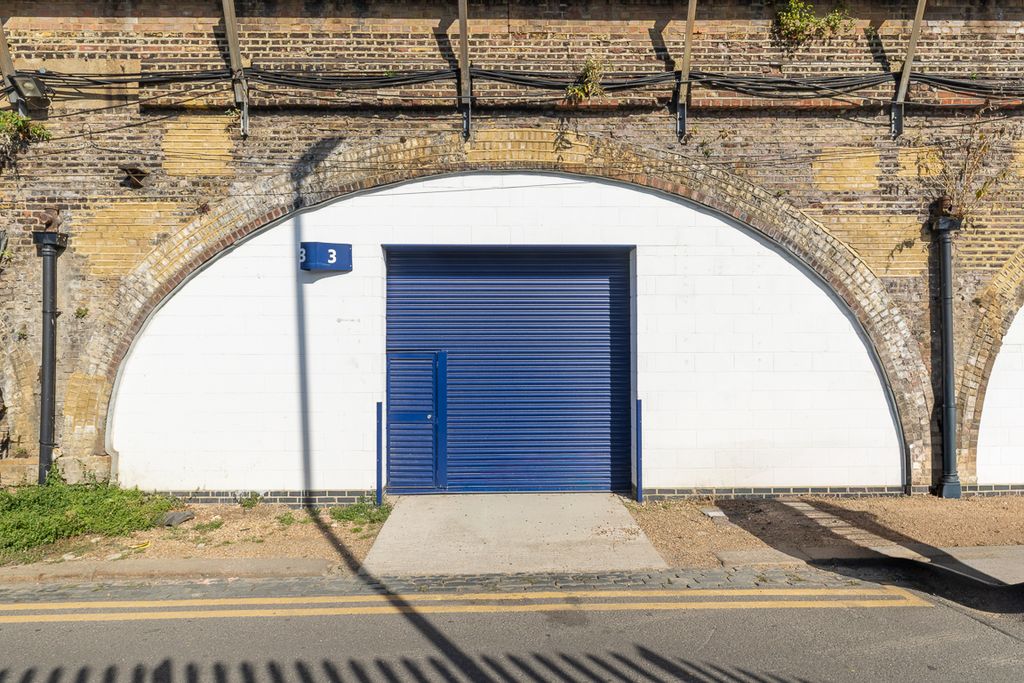 Property photo 1 of 3 The Front Of An Arch With A Closed Electric Roller Shutter Entrance Big Enough For Vehicle Access.