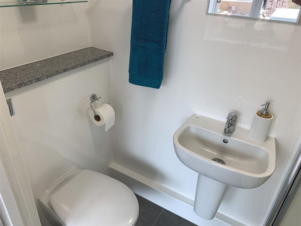 Property photo 2 of 11 Bright Modern Bathroom With Sleek Fixtures...