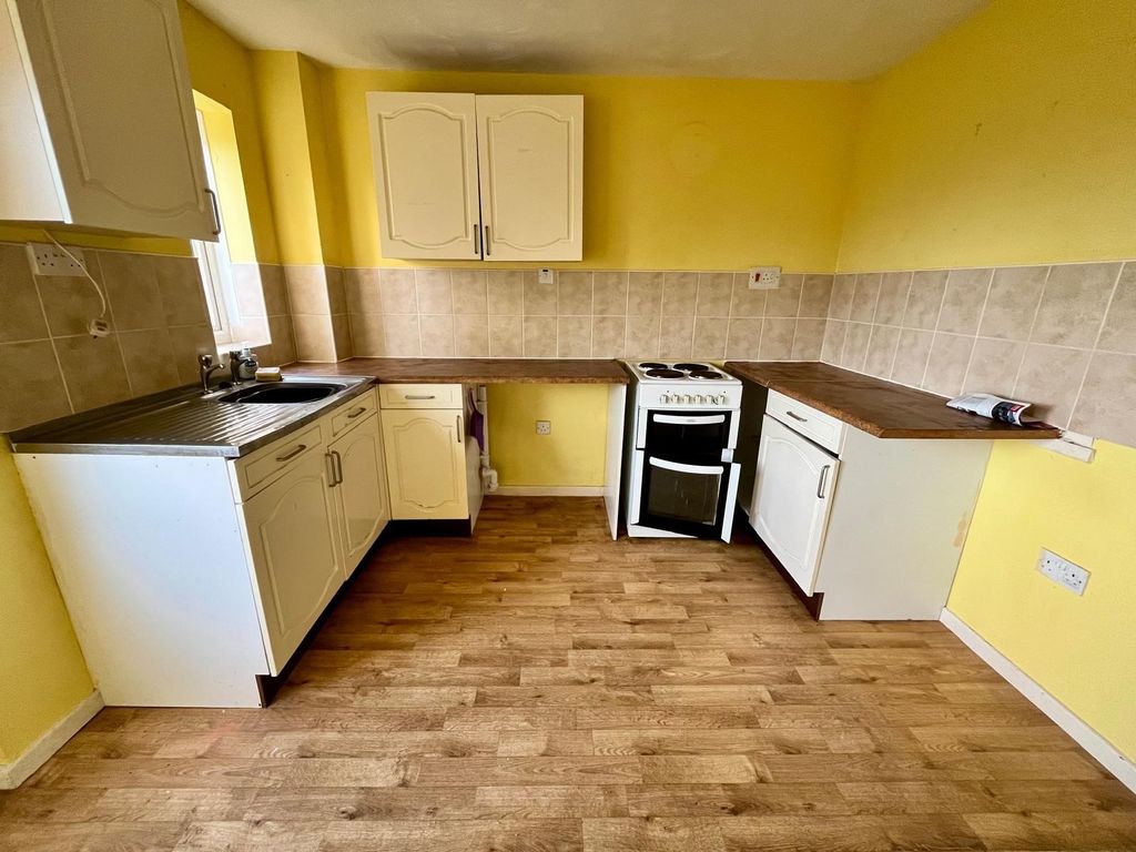 Property photo 2 of 12 Kitchen Area