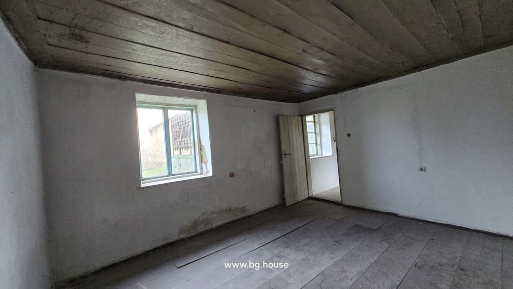 Property photo 2 of 52 Interior View Of An Empty Room Featuring A Wooden Ceiling, White Walls, Wooden Floor, And A Window.