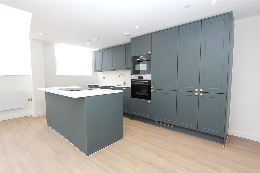 Property photo 1 of 13 Modern Kitchen With Stylish Island And Storage...