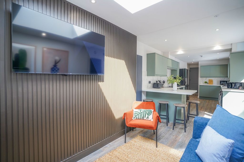 Property photo 2 of 13 Bright And Contemporary Living Room Featuring A Co...