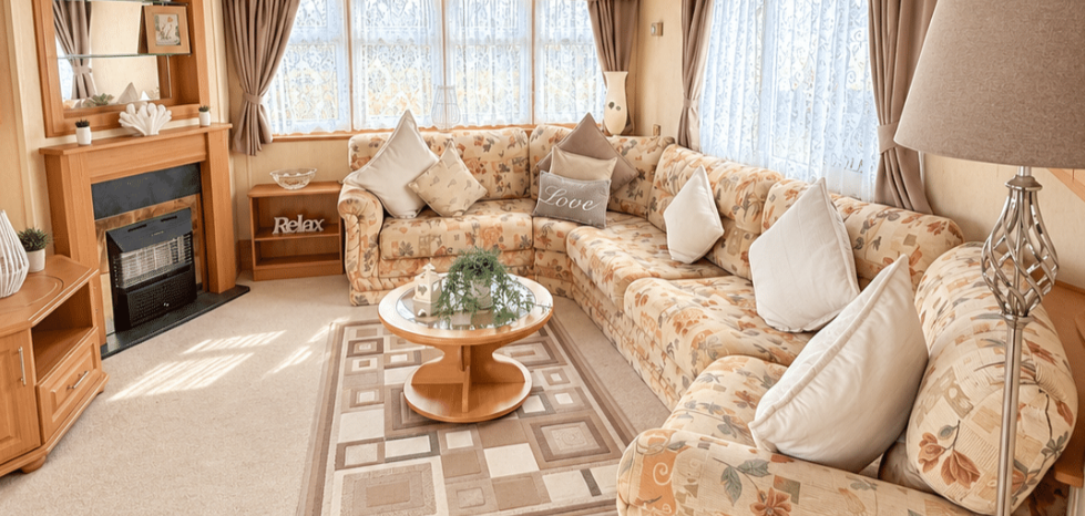 Property photo 2 of 13 Cosy Lounge With Floral Corner Sofa, Fireplace And Coffee Table
